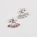 Detailed view of silver rocking horse charms with pink rhinestones for DIY jewelry - Silver / Red