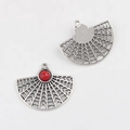 Macro detail of alloy fan pendant charm with red resin inlay for DIY jewelry crafts - Rhodochrosite