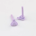 Macro shot of two light purple matte heart earring charms with vertical posts for DIY jewelry - Purple