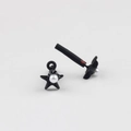 Detailed view of matte black star earrings with inlaid white pearls and tube components - Black Pearl