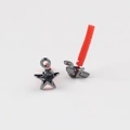 Macro detail of black star earrings with embedded round gemstone and metallic luster - Gun Black Zirconia