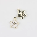Macro shot of gold-plated starfish charms with white enamel detail for DIY jewelry making - Gold Base White