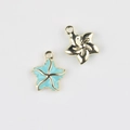 Detailed view of two starfish pendants in gold and light blue enamel for DIY jewelry - Gold Base Blue