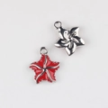 Close-up of red and silver starfish charms with metal loops for DIY jewelry projects - Silver Base Red
