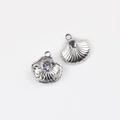 Macro view of shell-shaped alloy pendant with purple gemstone and starfish detail - Silver Purple Stone