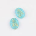 Detail view of turquoise glass beads with double-sided gold-gilded Chinese characters - Lake Blue (00853801)