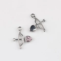 Detail showing front and back of silver Cupid bow and arrow charms with pink heart zircon - Silver/Pink Zirconia