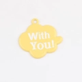 Detailed macro view of yellow cloud pendant with With You text and hanging hole - Yellow