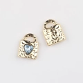 Detail of gold heart lock pendants with blue zircon inlay and textured metal surface - Gold Blue Rhinestone