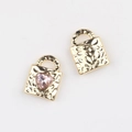 Detailed view of gold alloy heart-shaped lock pendants with pink zircon and hammer textures - Gold Pink Rhinestone
