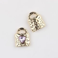 Detail of gold heart lock charms with hammered texture and pink cubic zirconia inlay - Gold Purple Rhinestone
