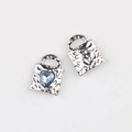 Macro shot of silver hammer-textured lock charms with heart-shaped blue zircon inlay - Silver Blue Rhinestone