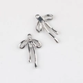 Détail de breloques nœud argentées avec zircon pour création de bijoux DIY - Argent Strass Blanc