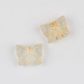 Detailed close-up of Czech glass butterfly beads with vintage gold-painted wing patterns - Clear