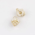 Detailed view of conch-shaped Czech glass beads with elegant gold foil accents - White