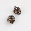 Macro detail of 11x13mm amber shell-shaped Czech glass beads with vintage gold accents - Transparent Dark Purple