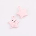 Close-up of pink star charms with bear pattern for DIY jewelry and necklaces - Star Pattern Pink