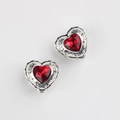 Detailed view of heart-shaped alloy pendant with red zircon and Luck engraving - Antique Silver Red Stone