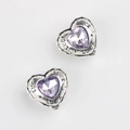 Detailed macro of heart charms with luck engraving and purple zircon inlay - Antique Silver Purple Zircon