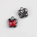 Macro view of butterfly pendant with red crystal stone and gunmetal gray alloy frame - Gun Black with Red Rhinestone