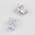 Macro view of moon and bow pendant charm with lavender resin and shimmering zircons - Silver Purple