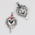 Detailed front and back view of silver heart and sword alloy pendant with red rhinestones - Silver / Red