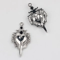 Macro shot of silver alloy heart pendant with black zircon inlays showing front and back - Silver Base Black Rhinestone