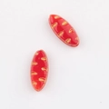 Macro view of red Czech glass willow leaf beads with gold-painted grooved textures - Red (01150801)
