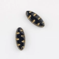 Detail showing two black oval glass beads with vintage gold leaf pattern engravings - Black (01151101)