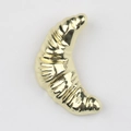 Macro view of golden croissant charm with realistic texture for DIY jewelry making - Gold