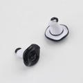 Close-up of minimalist black and white hat pendants for DIY jewelry making - Black and White