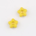 Detail of yellow star-shaped Czech glass beads with gold gilded center for DIY jewelry - Yellow (0901)