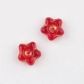 Macro shot of red glass flower beads with vintage gold details for DIY jewelry making - Transparent Red (0501)