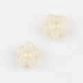 Macro detail of cream star-shaped glass beads with vintage gold gilded edges and center - White (2501)