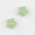 Detail of Czech glass star beads with gold-gilded edges for DIY jewelry making - Light Green (2201)