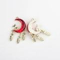 Detailed alloy moon pendant with red enamel, gold texture, and sparkling feather tassels - Gold Base Red
