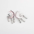 Detail of moon and star pendant with resin inlay and delicate feather charms - Silver Base Pink