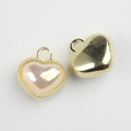Detail showing heart charm with pearl-like inlay and golden beaded border, front and back - Gold Base Yellow
