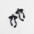 Glossy black alloy bow pendants for DIY jewelry making, showing fine texture and loop - Black