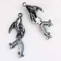 Detailed front and back view of gunmetal fish charms with translucent resin inlays - Gun Black White