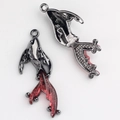 Detailed front and back views of goldfish charms with red resin tails for DIY jewelry - Gun Black Red