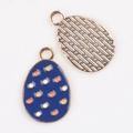 Detail of colorful enamel egg charms with rose gold metal textured back for DIY jewelry - Dark Blue Dots (01)