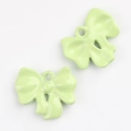 Detail of light green enamel bow charms with polished finish for DIY jewelry crafts - Green