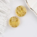 Detail of amber glass cat beads with gold engraved lines for DIY jewelry making - Yellow