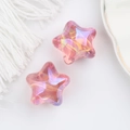 Macro detail of acrylic colorful iridescent star beads for DIY jewelry and crafts - Metallic Rose Red