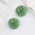 Detail of green Czech glass beads with gold cat engraving for DIY jewelry making - Verdant