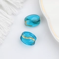 Detail of blue transparent Czech glass beads with gold painted edges for DIY jewelry - Sky Blue (00141401)