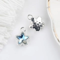 Macro detail of star-shaped charm with blue crystal inlay and vintage hammer texture - Silver Base Blue / Silver Base Blue