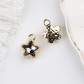 Detail of 11mm star pendant with black zircon inlay and hammered metal texture back - Gold Base Black