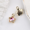 Detail of 11mm star pendant with pink crystal and golden hammered metal texture - Gold Base Gradient Red